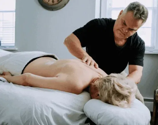 Mark Heilshorn working on a client’s back in the Westport studio