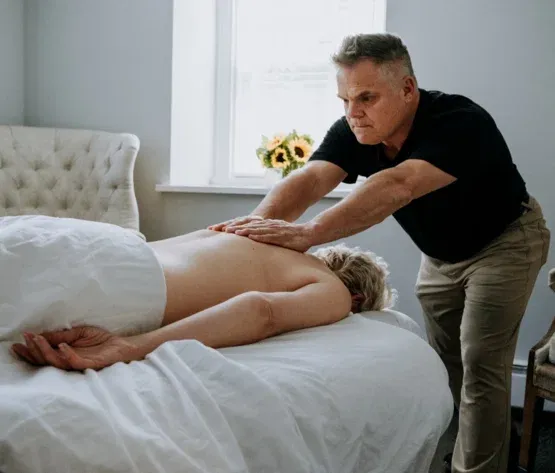 Mark Heilshorn working on a client’s leg during massage