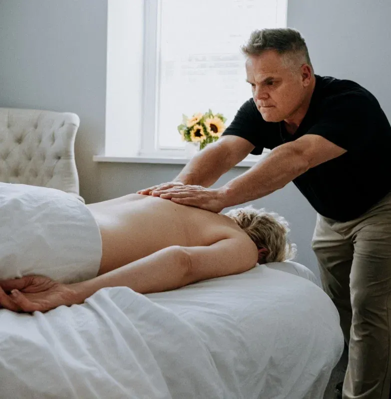 Mark Heilshorn working on a client’s leg during massage