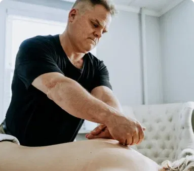 Mark Heilshorn providing hands-on massage therapy