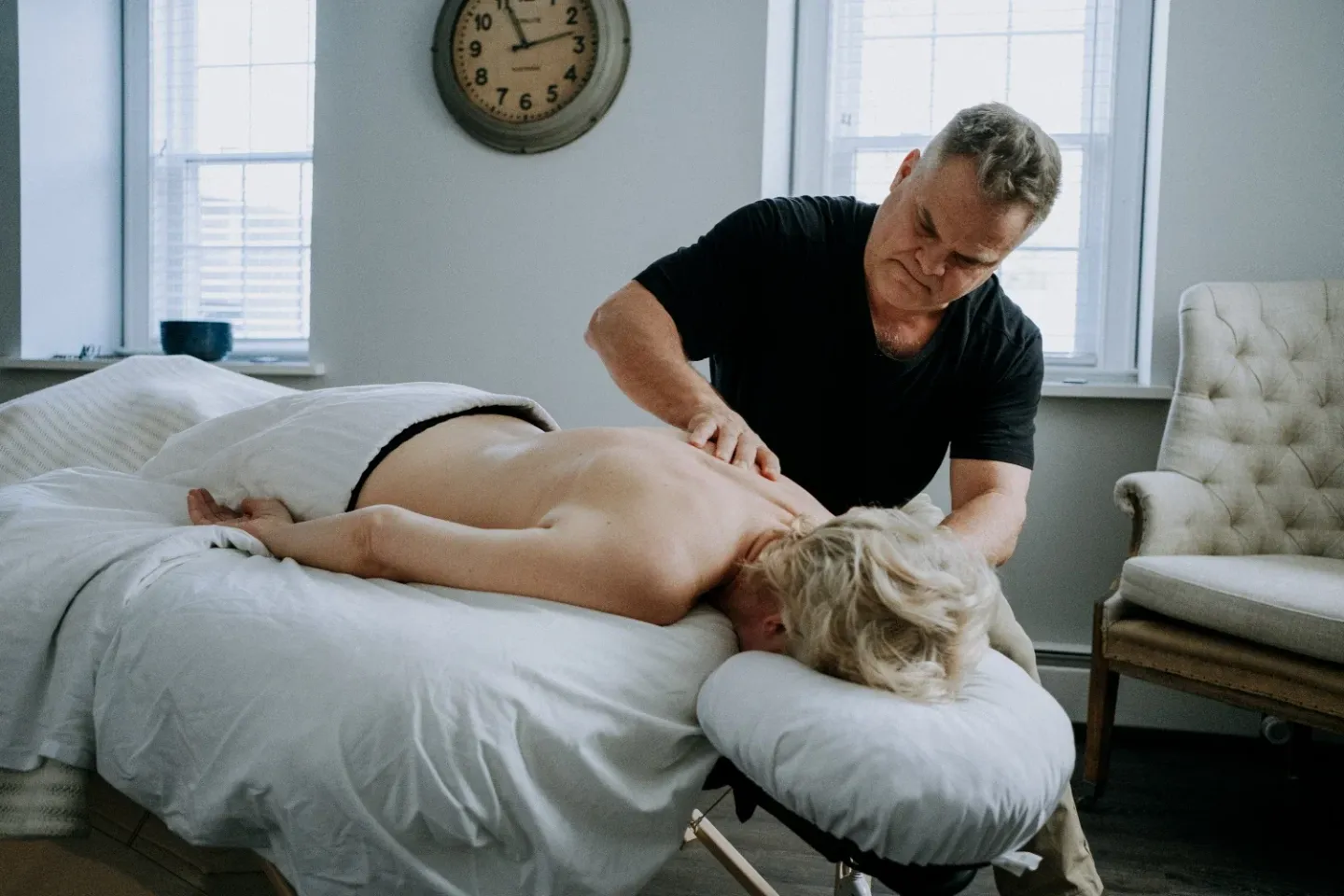 Mark Heilshorn working on a client’s back in the Westport studio
