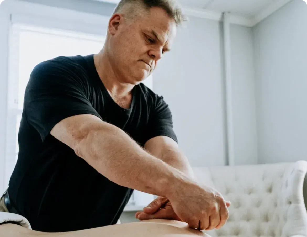 Mark Heilshorn providing hands-on massage therapy