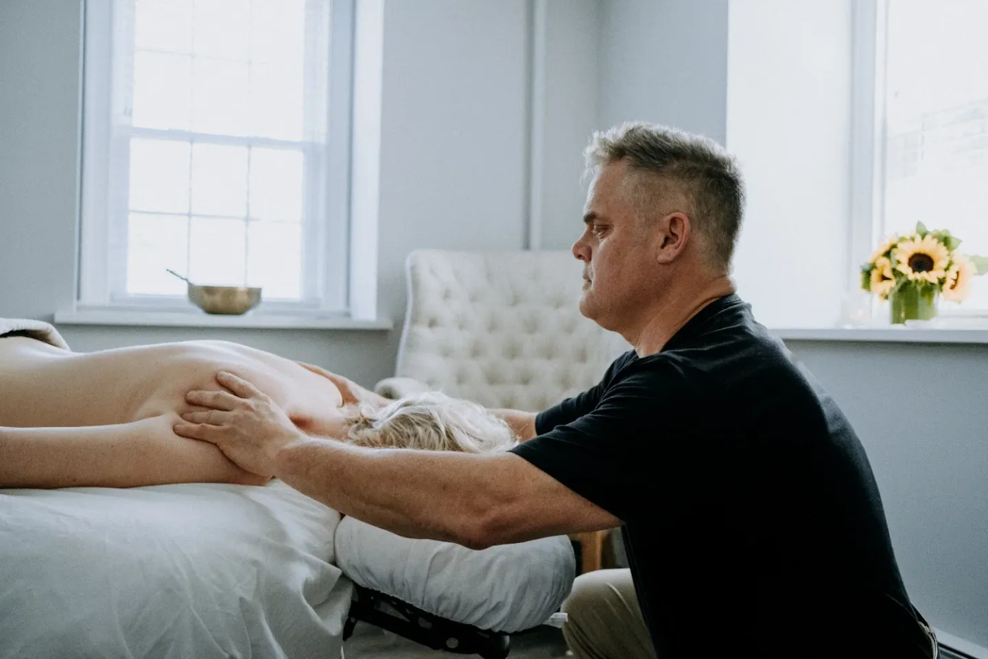 Mark Heilshorn working on a client’s leg during massage